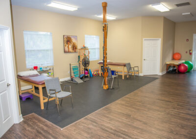 Treatment tables in open gym area additional therapy equipment