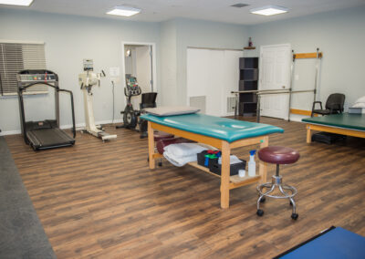 Physical Therapy clinic in Bradenton Gym Area with Cardio machines and treatment tables