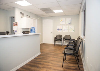 Physical Therapy Reception Area with chairs and wall art