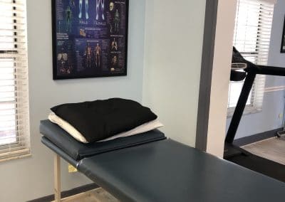 Physical Therapy treatment area Punta Gorda Florida treatment table and anatomy picture