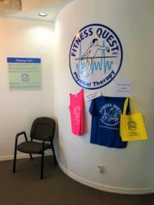 Physical Therapy waiting room Punta Gorda Florida reception chair, company logo on wall and company values poster
